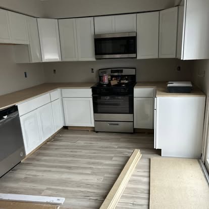 Newly remodeled kitchen with white shaker cabinets